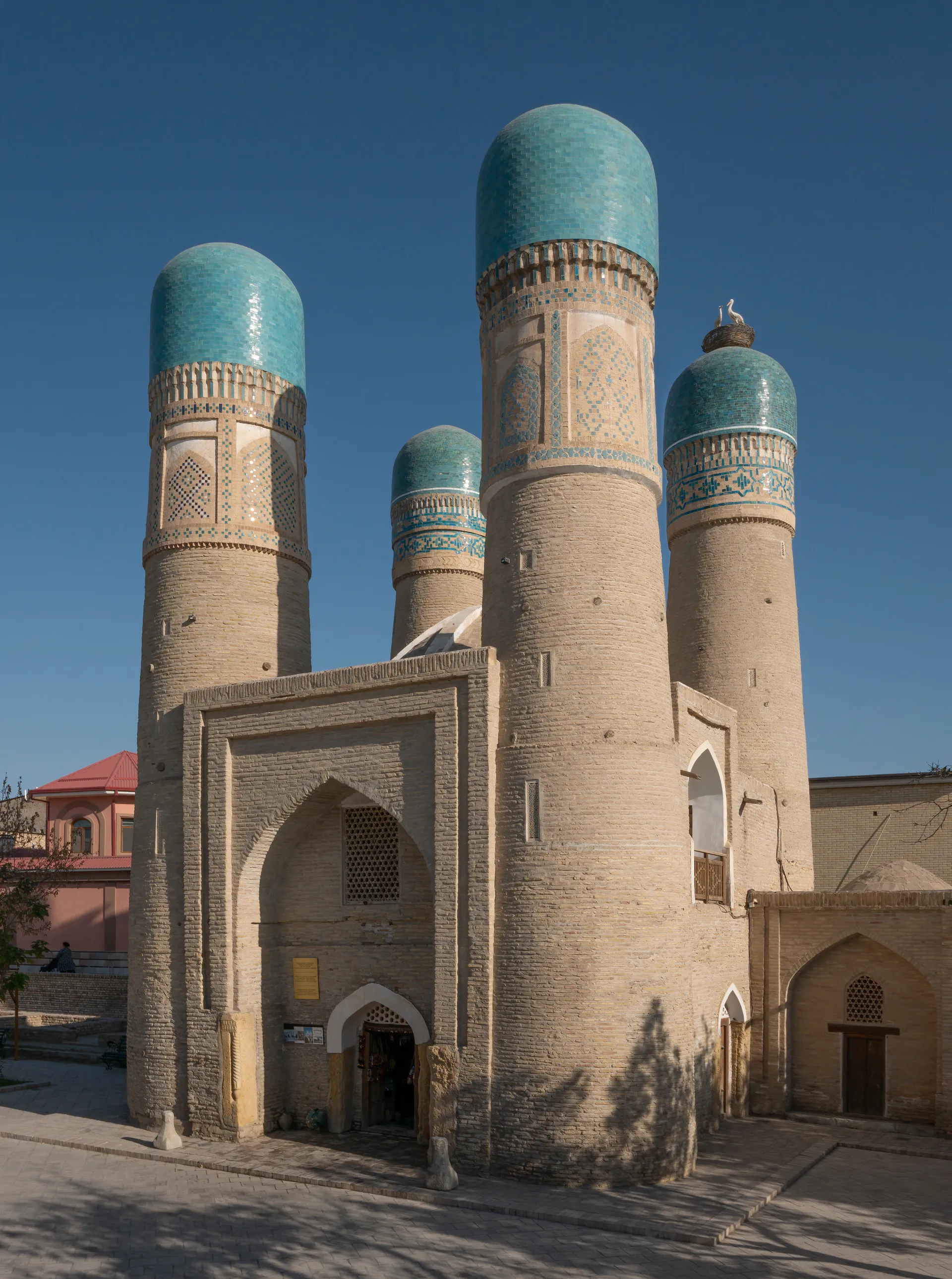 The four turquoise-capped towers of Chor Minor, the gatehouse of a madrasah built in 1807 by a wealthy Bukharan merchant.
