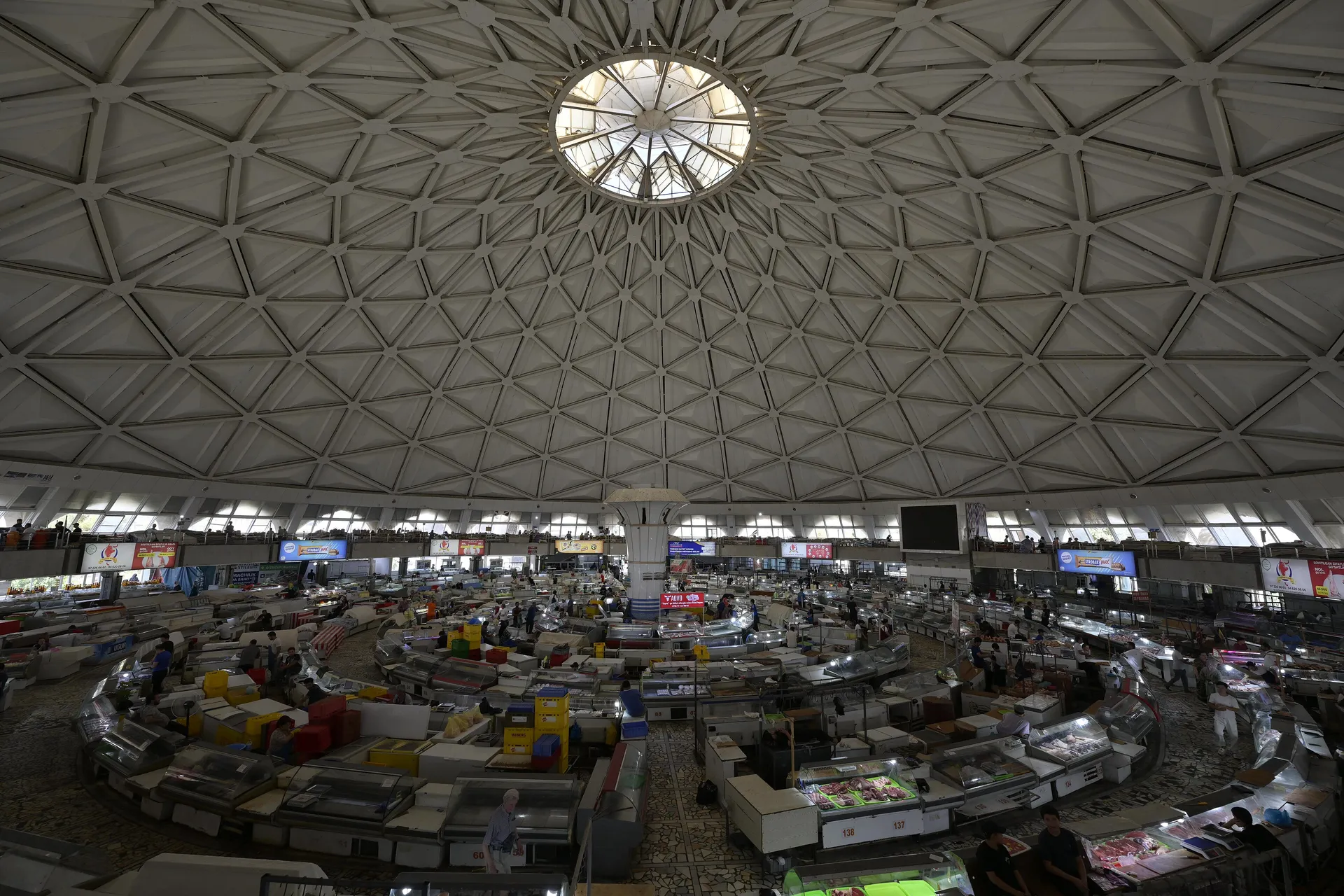 Rings of stalls beneath the great patterned dome of Chorsu Bazaar in old Tashkent, where spices, dried fruit and dairy are sold.