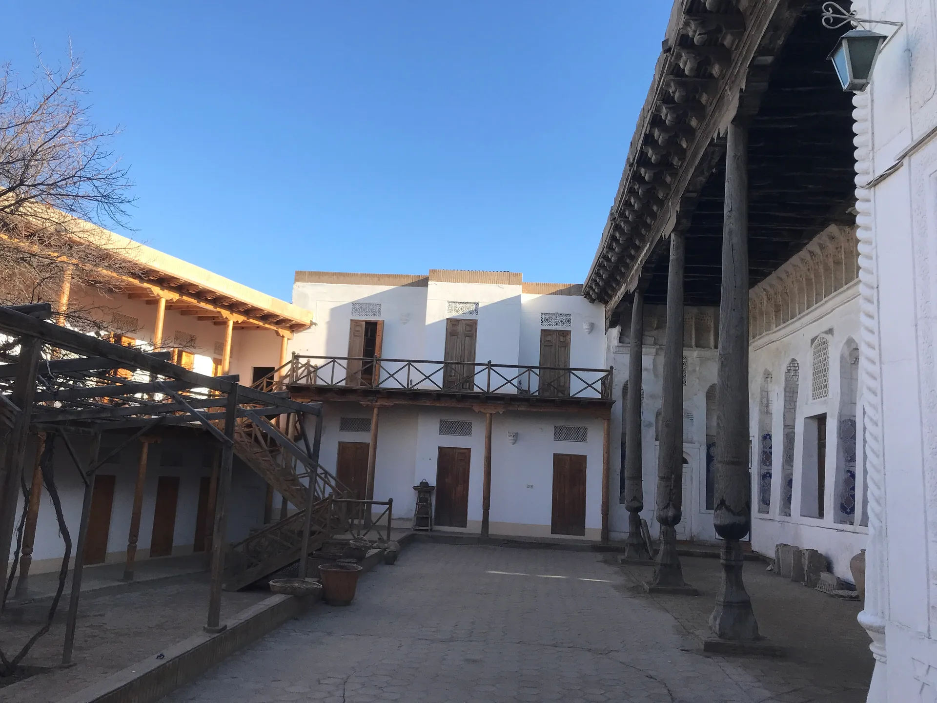 The Museum of Jadid History, set in a restored traditional house with a carved wooden porch around its courtyard.