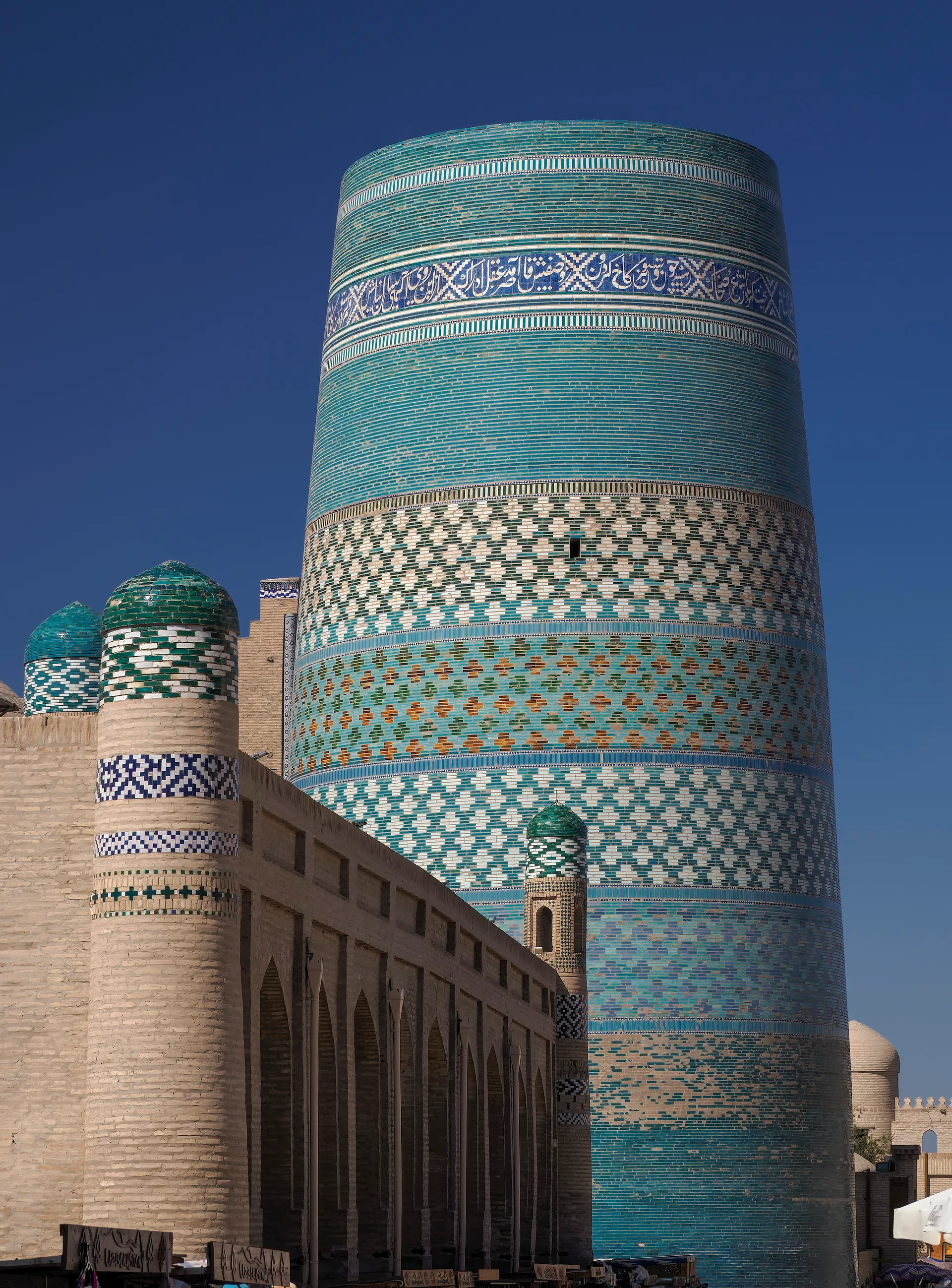 The “short minaret”, begun in 1851 to be the tallest in Central Asia and left unfinished — wrapped in turquoise and green tiles.