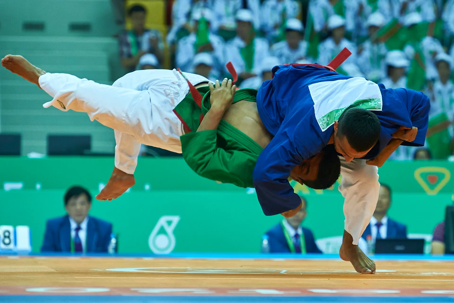 A throw at the 2017 Asian Indoor and Martial Arts Games. Kurash, Uzbekistan's ancient wrestling style, is fought standing, in jackets, and has an international federation founded in Tashkent in 1998.