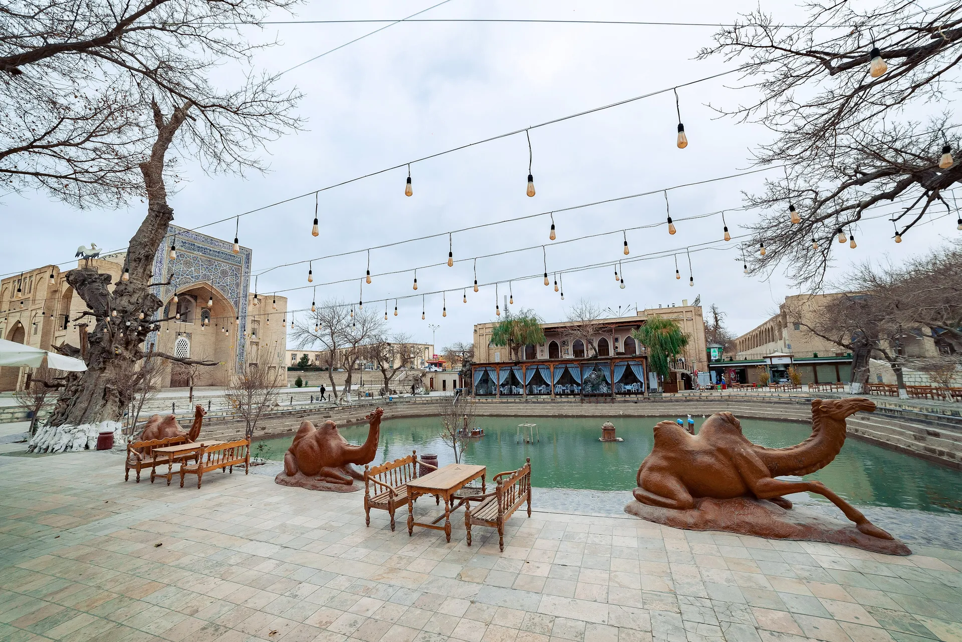 The 17th-century pool at the centre of old Bukhara, shaded by mulberry trees and framed by the Nadir Divan-Begi madrasah and khanqah.