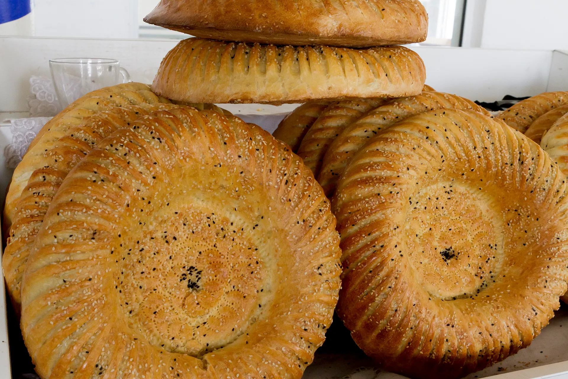 Round Uzbek non stacked for sale at Chorsu market in Tashkent, each stamped in the middle with a chekich so it doesn't puff up.