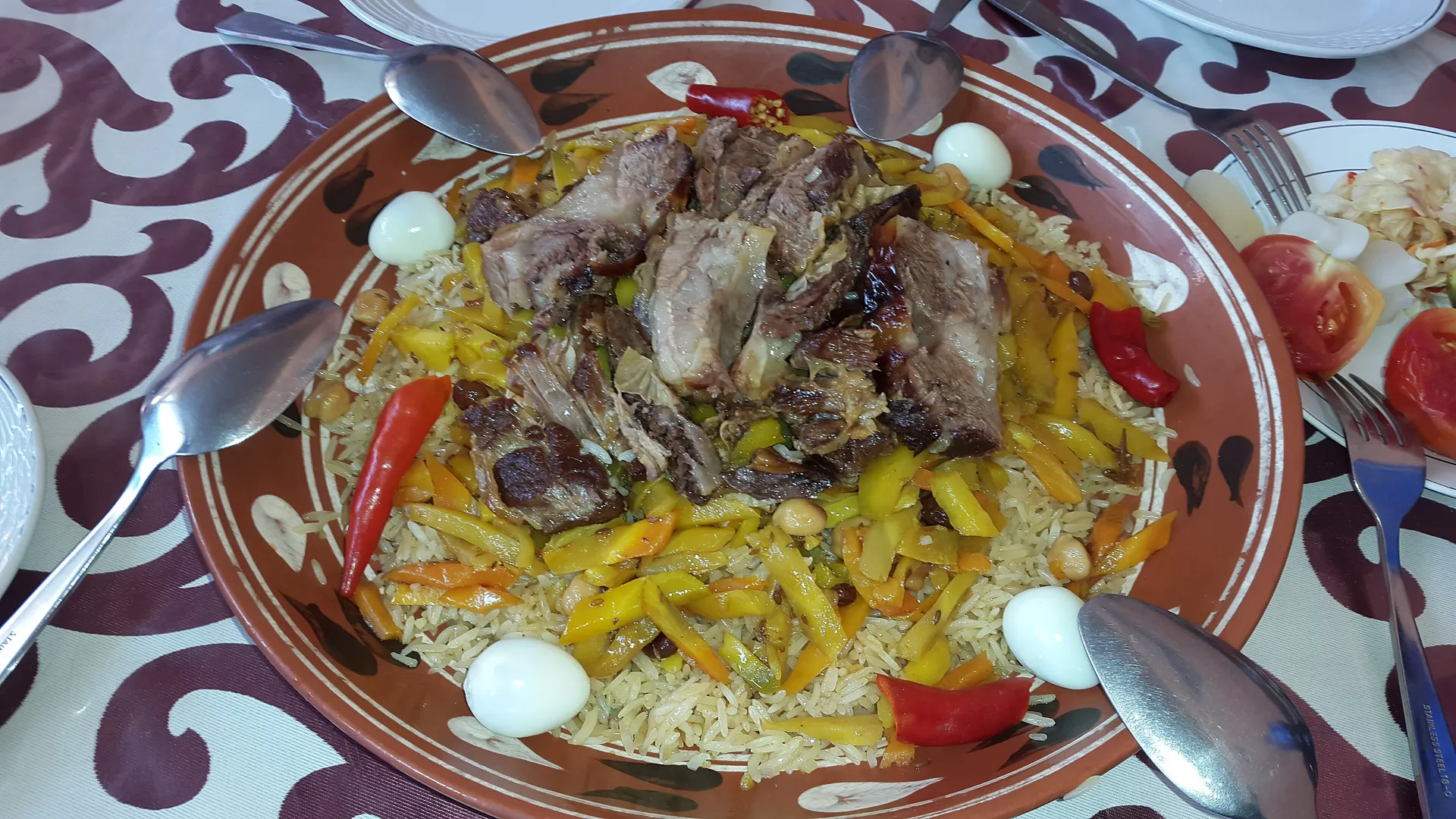 Plov the Samarkand way: the rice is laid over the meat and carrots and never stirred, so each layer keeps its own flavour.